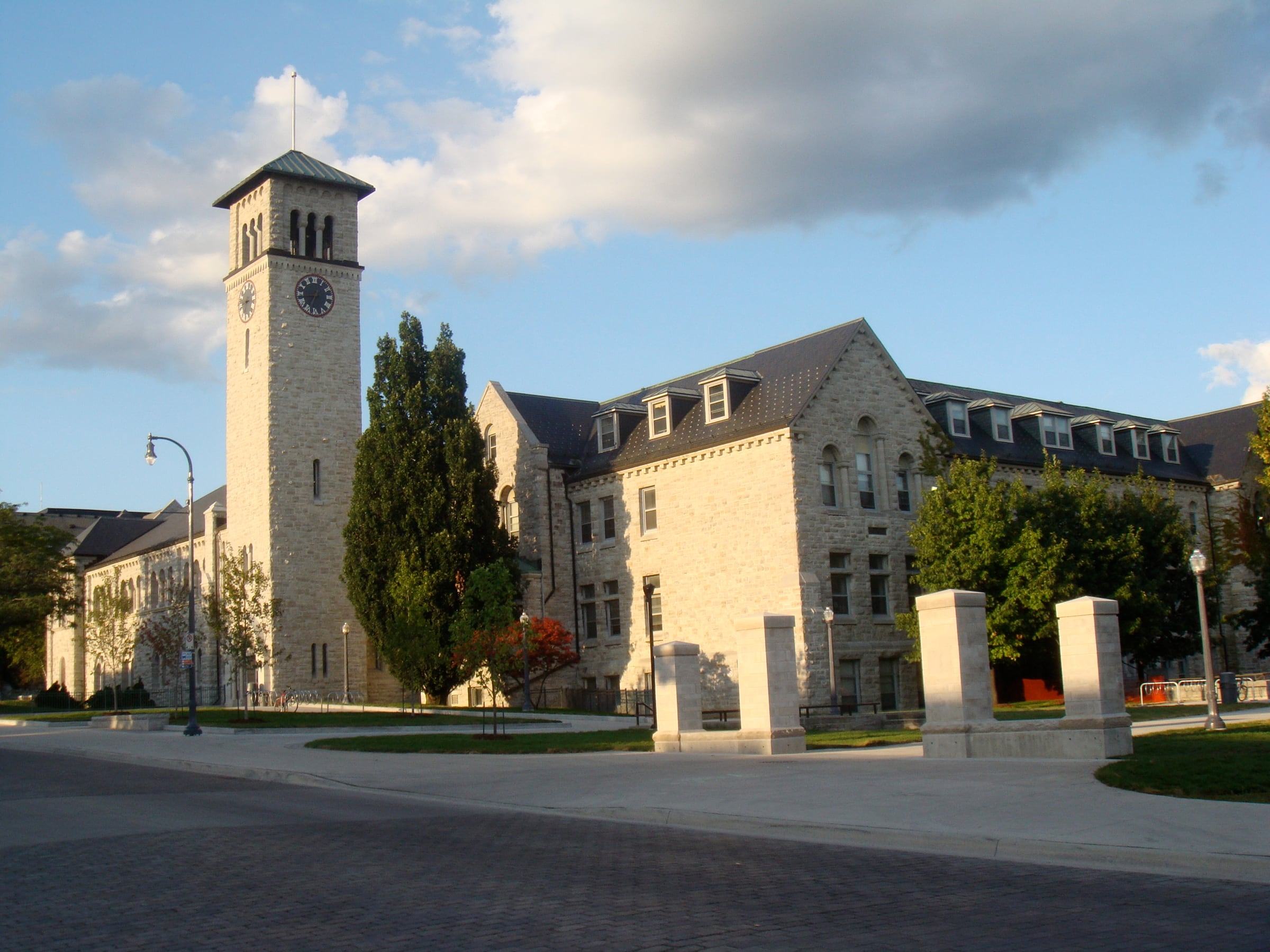 Grant Hall's limestone clock tower at Queen's University in Kingston in evening light