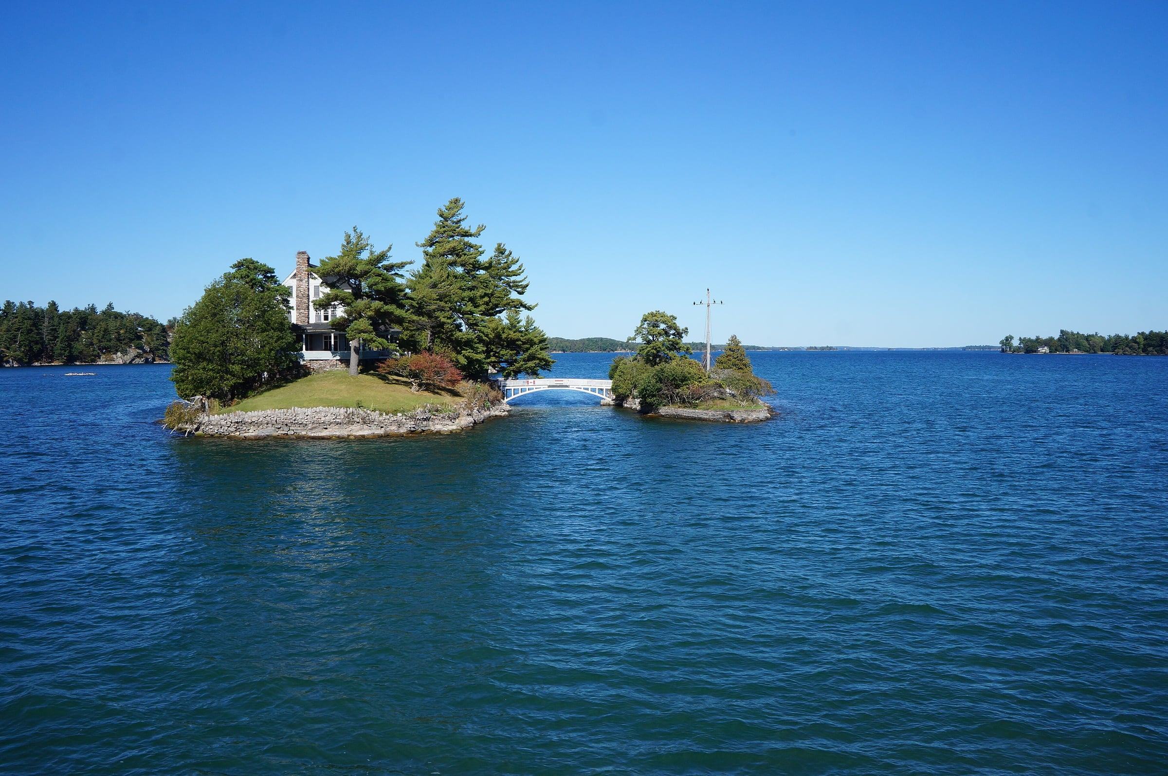 Zavikon Island's cottage and tiny footbridge on the St. Lawrence River in the Thousand Islands